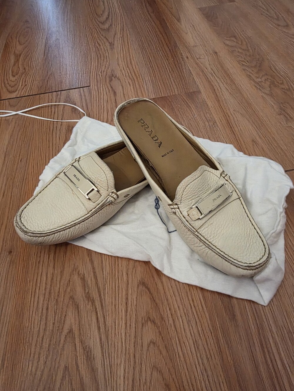 Prada Women Cream Leather Slip-On Loafers with Buckle Detail